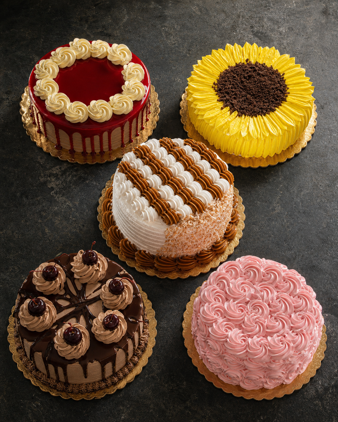 A spread of five cakes