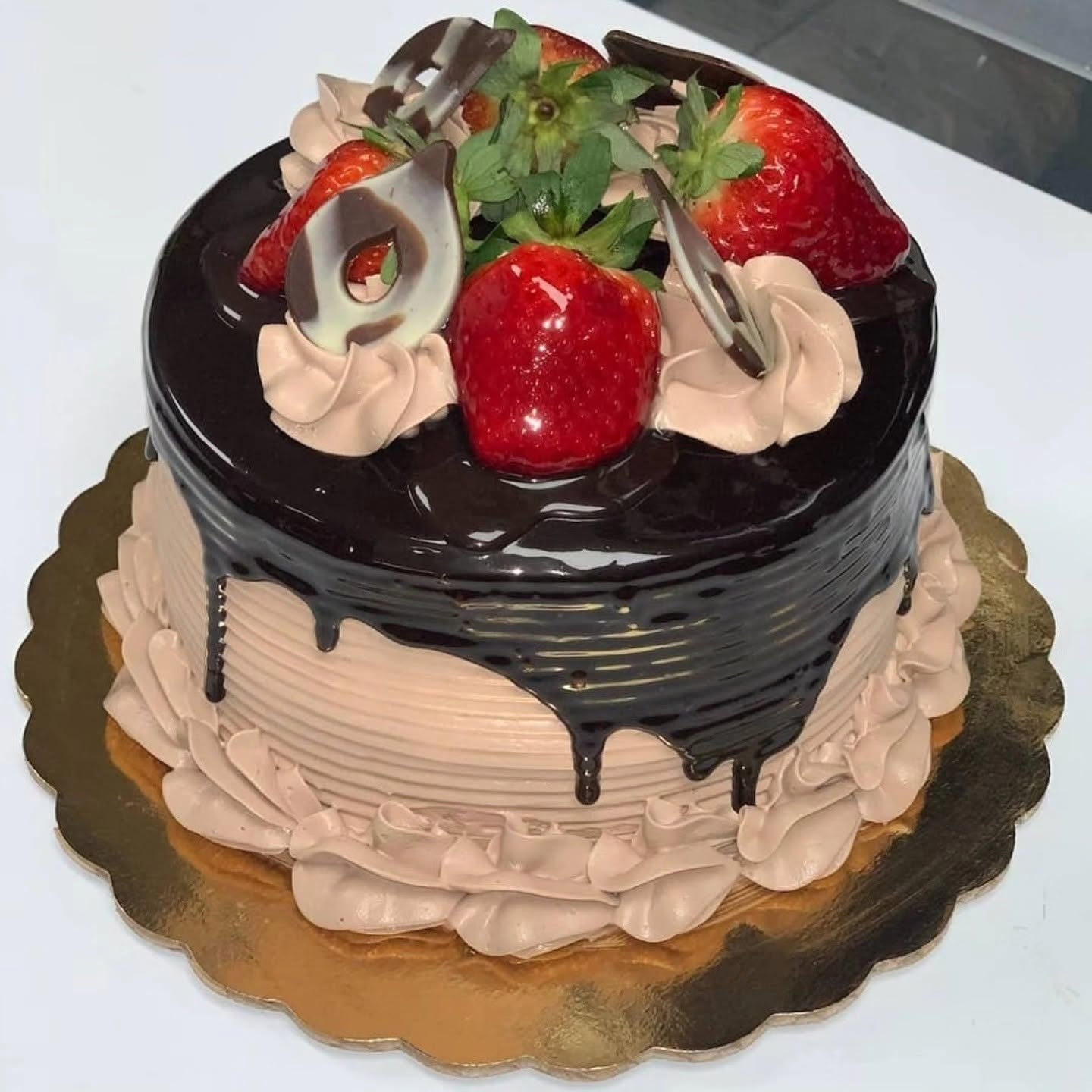 Chocolate and strawberry cake in the case