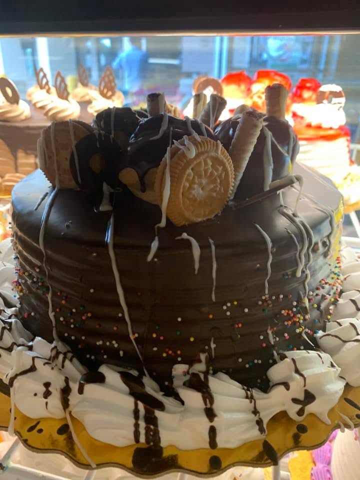 Chocolate ganache drip cake with a cookie crown
